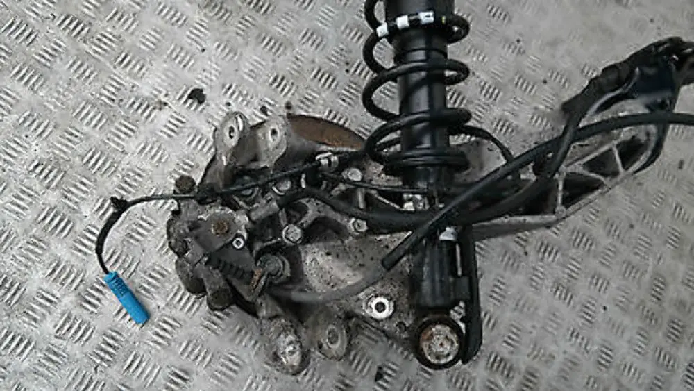 BMW Mini R56 One Coupé N12 REAR LEFT SPRING STRUT LEG BRAKE SUSPENSION HUB N/S