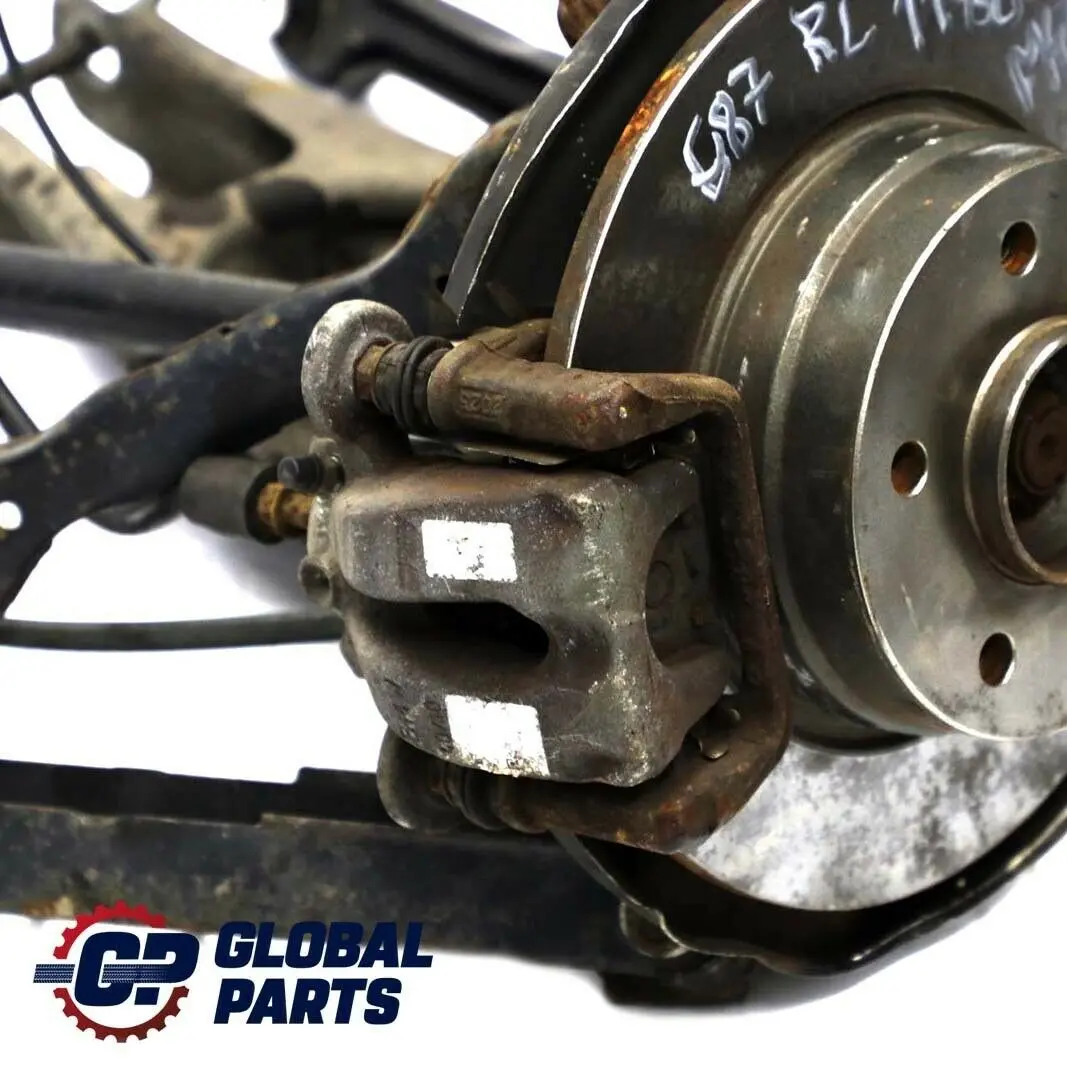 BMW E87 118d M47N2 trasera izquierda  Pierna Suspension Eje Freno Disco Hub