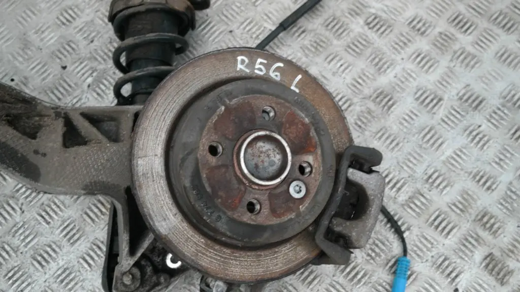 BMW Mini R56 One Coupé N12 REAR LEFT SPRING STRUT LEG BRAKE SUSPENSION HUB N/S - SKU 22245221 - Part number 22245221