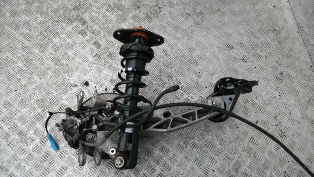 Coupé N12 REAR LEFT SPRING STRUT LEG BRAKE SUSPENSION HUB N/S to BMW Mini R56 One with Part number 22245221 BMW Mini R56 One Coupé N12 REAR LEFT SPRING STRUT LEG BRAKE SUSPENSION HUB N/S - SKU 22245221 - Part number 22245221