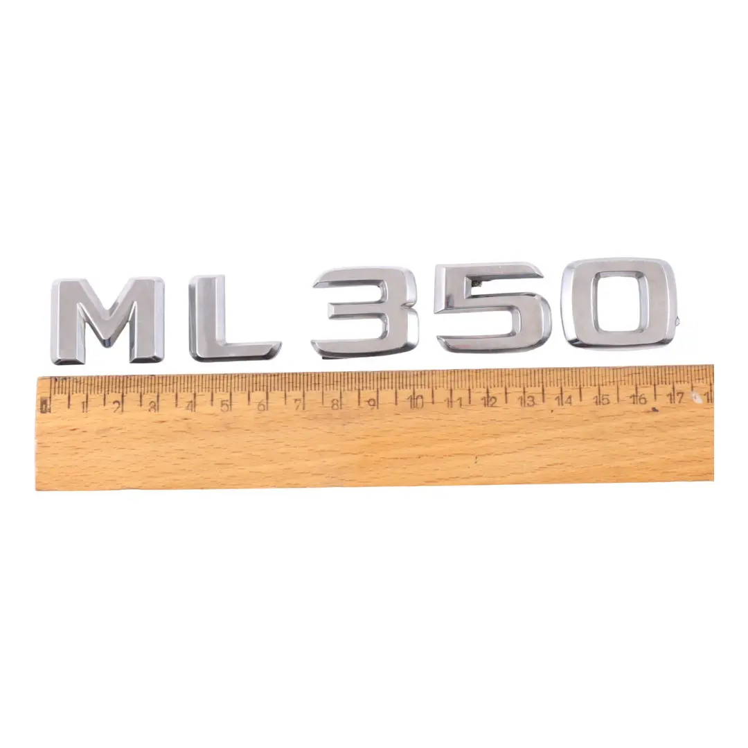 Emblemat Logo Klapy Bagażnika Tył Chrom do Mercedes W166 ML 350 o numerze A1668171215 Mercedes W166 ML 350 Emblemat Logo Klapy Bagażnika Tył Chrom - SKU A1668171215 - Numer Części A1668171215