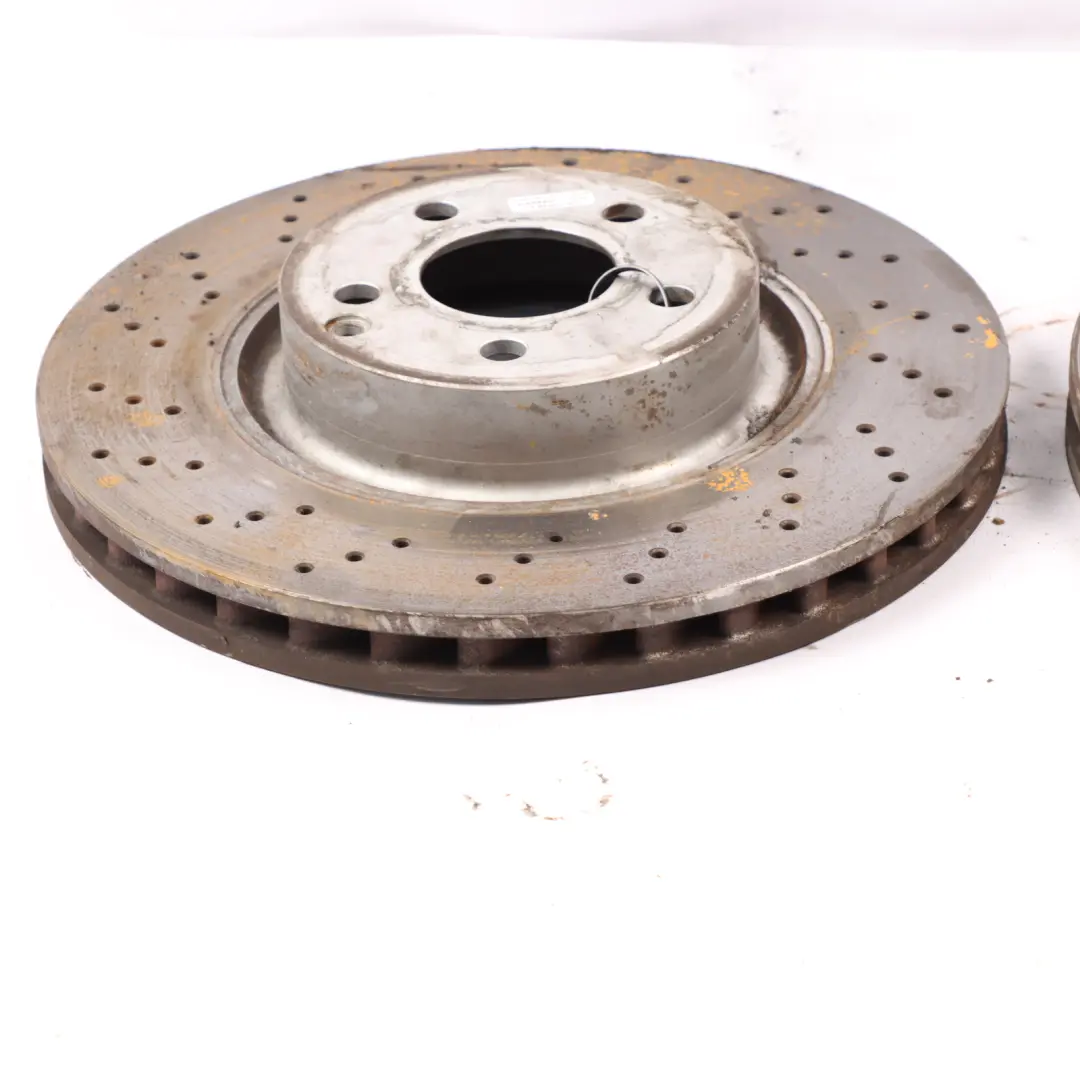 Brake Disc Set Front Left Right Wheel N/O/S Perforated Discs to Mercedes W221 with Part number A2214211712 Mercedes W221 Brake Disc Set Front Left Right Wheel N/O/S Perforated Discs - SKU A2214211712 - Part number A2214211712
