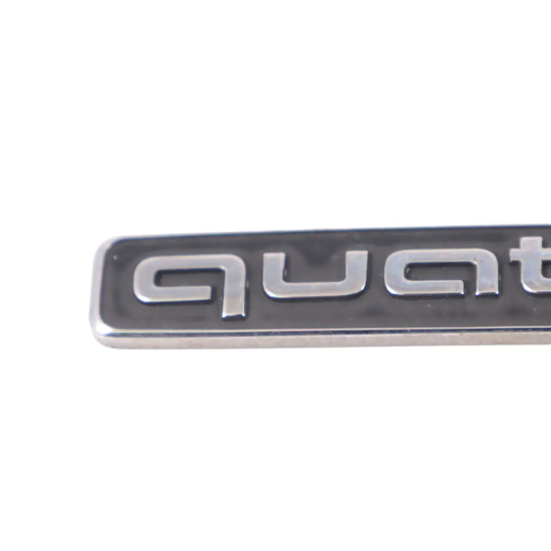 Emblemat Napis Tylnej Klapy Pokrywy Bagażnika Quattro do Audi Q3 8U o numerze 4G0853737 Audi Q3 8U Emblemat Napis Tylnej Klapy Pokrywy Bagażnika Quattro - SKU 4G0853737 - Numer Części 4G0853737