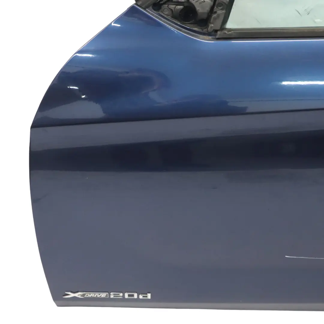 Porta anteriore sinistra Tiefseeblau Deep Sea Blue Metallic - A76 per BMW X1 E84 con numero di parte 7339357 BMW X1 E84 Porta anteriore sinistra Tiefseeblau Deep Sea Blue Metallic - A76 - SKU 7339357-DSB - Numero di parte 7339357