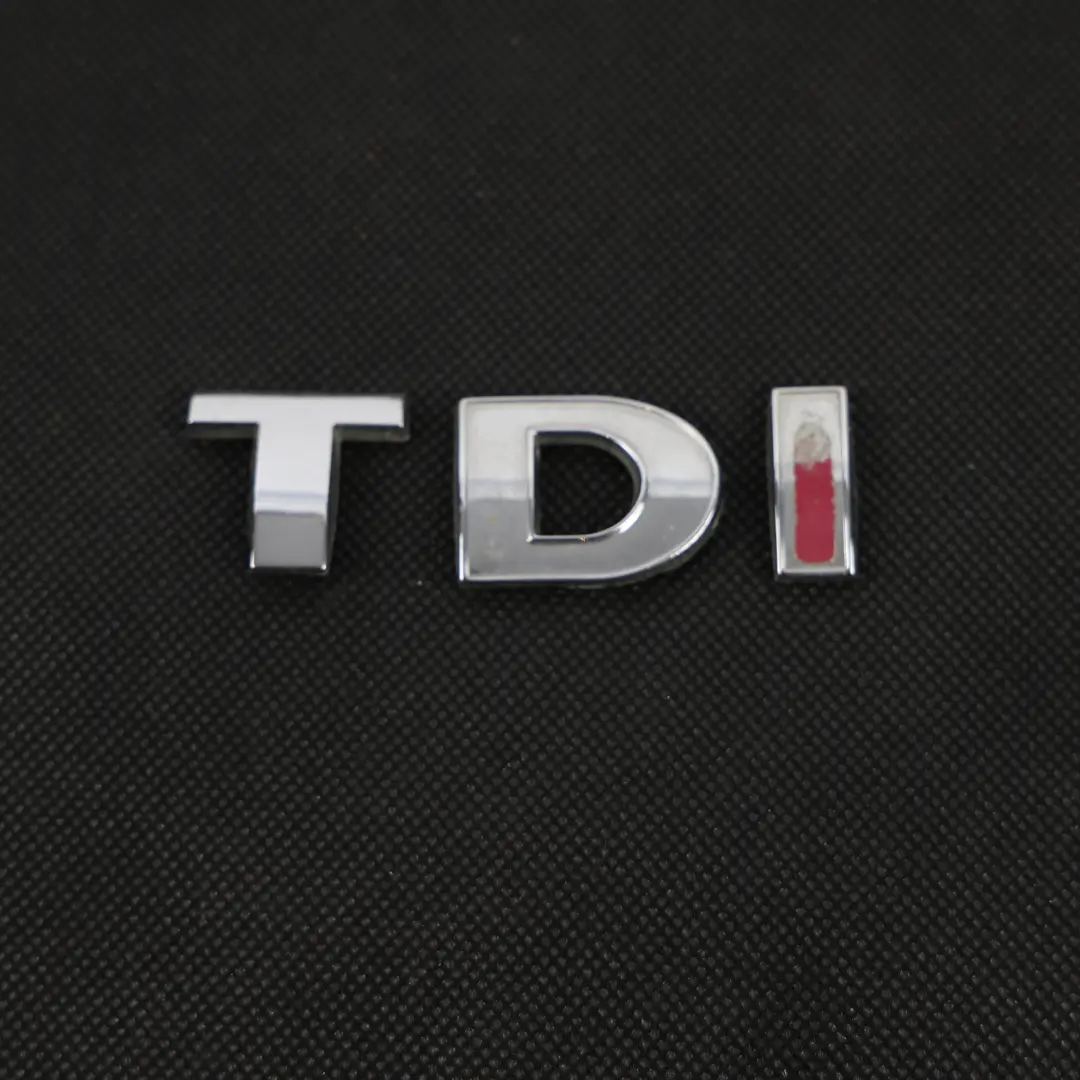 Volkswagen Transporter T5 Emblemat Napis Klapy Bagażnika TDI - SKU 3B0853675AC - Numer Części 3B0853675AC