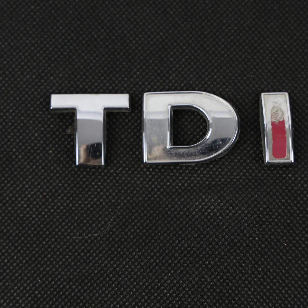 Kofferraum Emblem Schriftzug für Volkswagen Transporter T5 TDI mit Teilenummer 3B0853675AC Volkswagen Transporter T5 TDI Kofferraum Emblem Schriftzug - SKU 3B0853675AC - Teilenummer 3B0853675AC