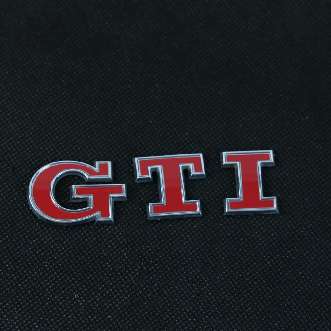 5G Heck Emblem Logo Abzeichen Schriftzug GTI für Volkswagen Golf GTI mit Teilenummer 5G0853675AC Volkswagen Golf GTI 5G Heck Emblem Logo Abzeichen Schriftzug GTI - SKU 5G0853675AC - Teilenummer 5G0853675AC