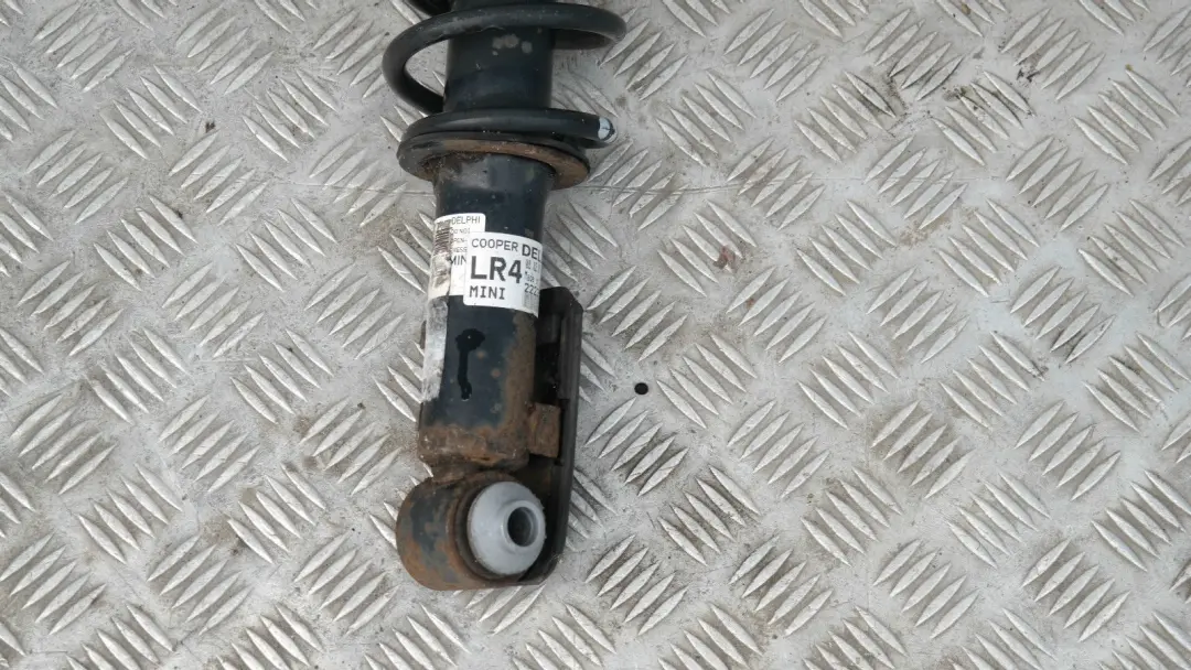 Coupé Muelle Strut Amortiguador Trasero Izquierdo para Mini R56 Cooper con número de pieza 22235767 Mini R56 Cooper Coupé Muelle Strut Amortiguador Trasero Izquierdo - SKU 22235767-1 - Número de pieza 22235767
