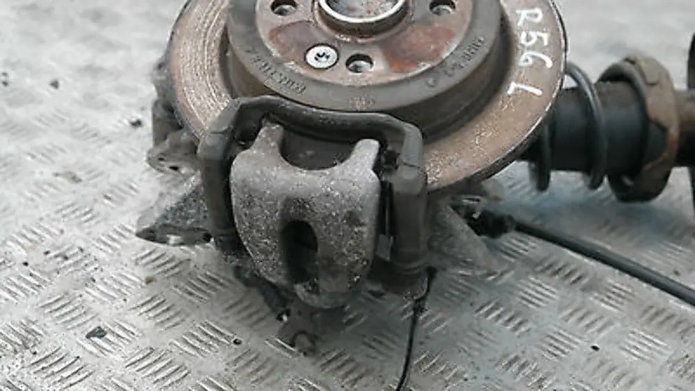 Coupé N12 REAR LEFT SPRING STRUT LEG BRAKE SUSPENSION HUB N/S to BMW Mini R56 One with Part number 22245221 BMW Mini R56 One Coupé N12 REAR LEFT SPRING STRUT LEG BRAKE SUSPENSION HUB N/S - SKU 22245221 - Part number 22245221