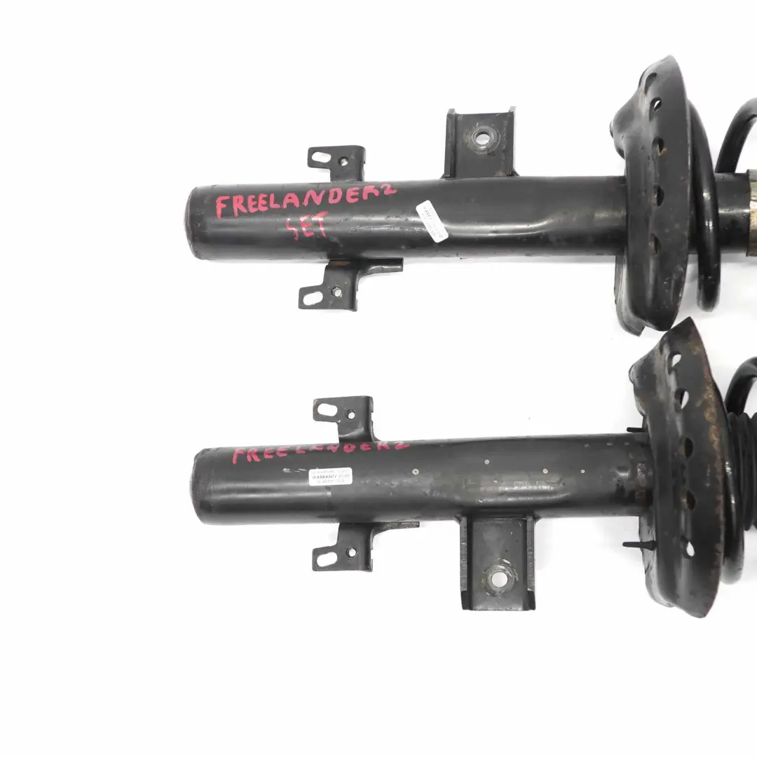 Juego KYB Amortiguador Trasero Izquierdo Derecho Muelle para Land Rover Freelander 2 con número de pieza 335831 Land Rover Freelander 2 Juego KYB Amortiguador Trasero Izquierdo Derecho Muelle - SKU 335831 - Número de pieza 335831