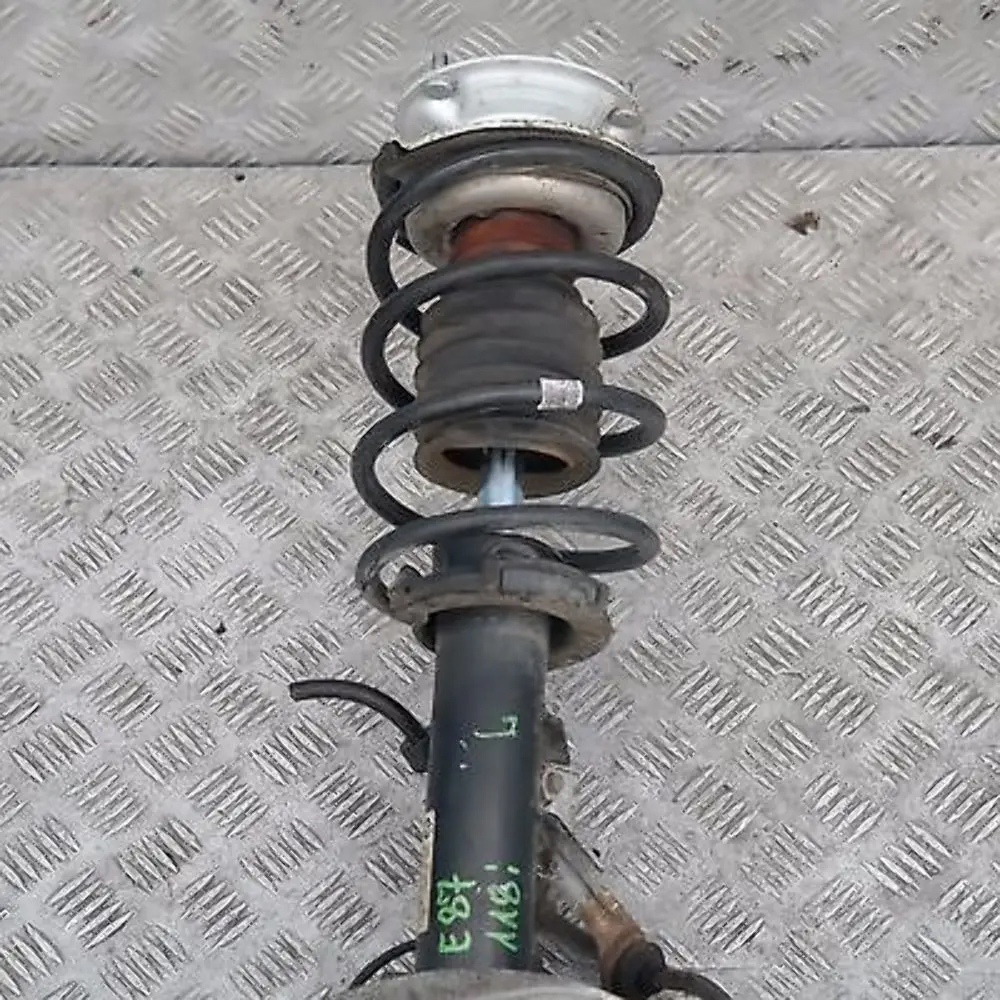 Delantero Izquierdo Muelle Strut Freno Suspension Pata Buje BMW E87 LCI 118i - SKU 6771553-2 - Número de pieza 31316771553