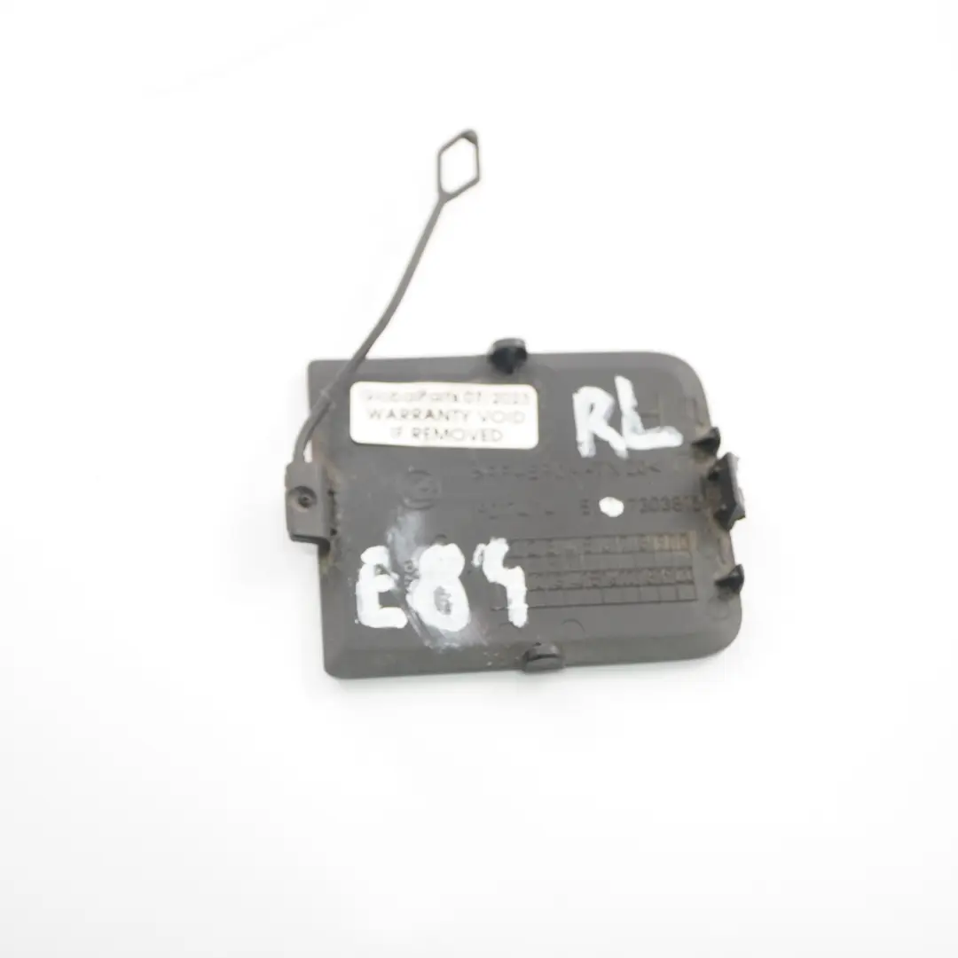 BMW X1 E84 Couvercle pare-chocs arrière Rabat Crochet remorquage Capuchon gauche - SKU 7303815 - Numéro de pièce 7303815