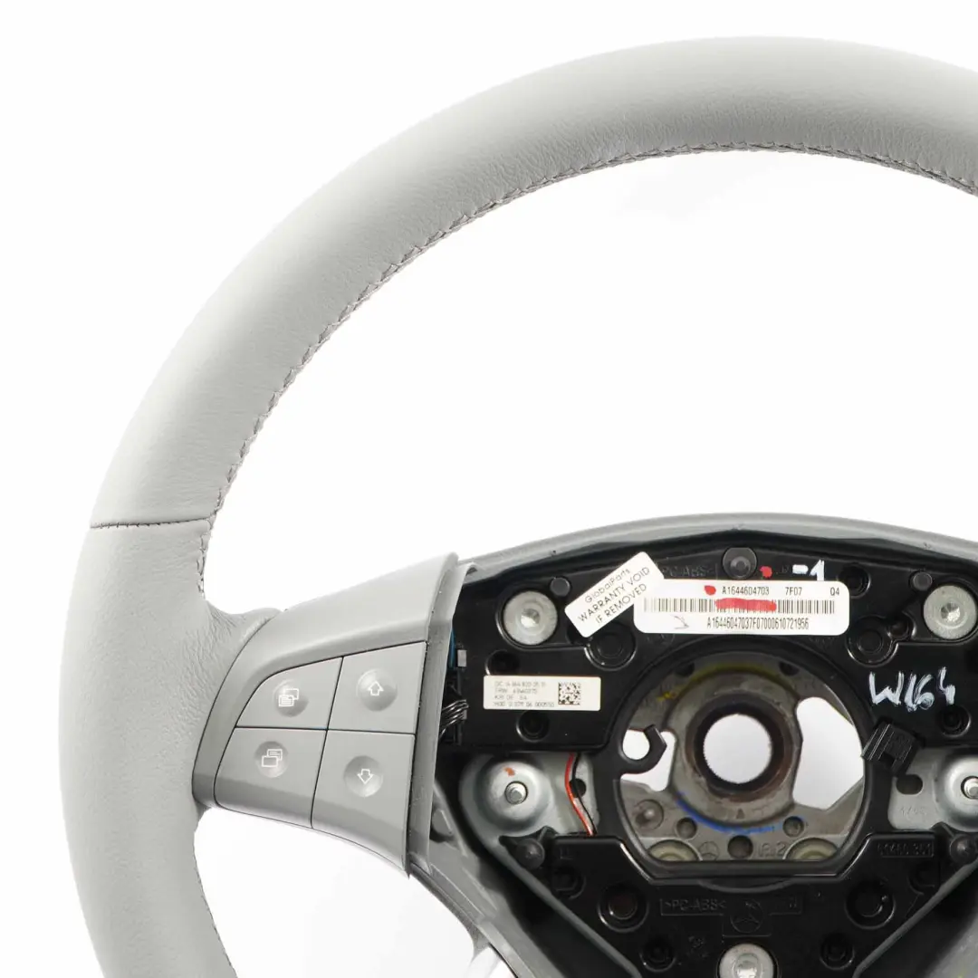 NUOVO Volante in pelle grigio multifunzione per Mercedes ML W164 con numero di parte A1644604703 Mercedes ML W164 NUOVO Volante in pelle grigio multifunzione - SKU A1644604703-1 - Numero di parte A1644604703