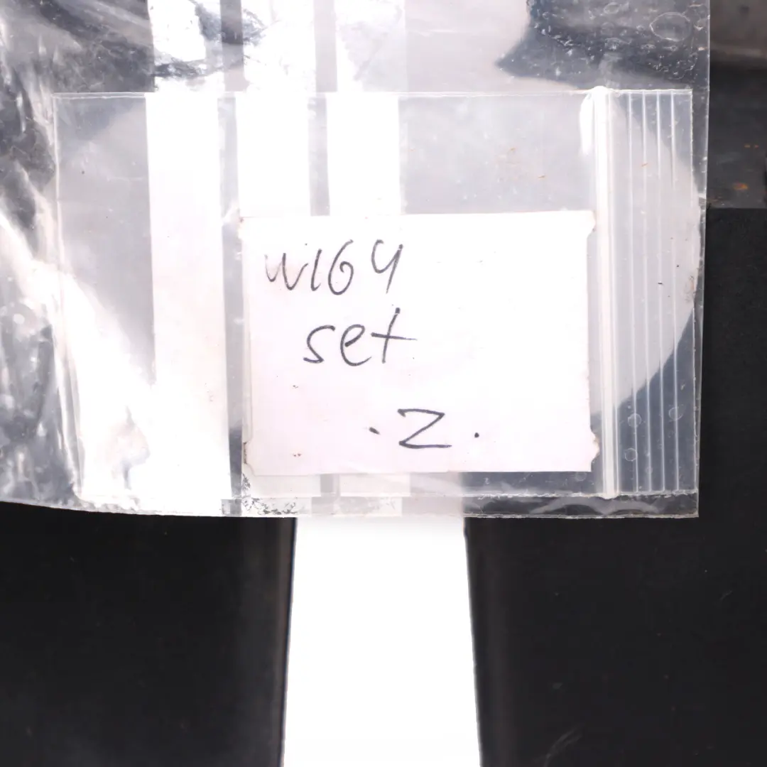 Fender Mud Flap Splash Guard Trim Panel Set to Mercedes ML W164 Rear with Part number A1648990540 Mercedes ML W164 Rear Fender Mud Flap Splash Guard Trim Panel Set - SKU A1648990540 - Part number A1648990540