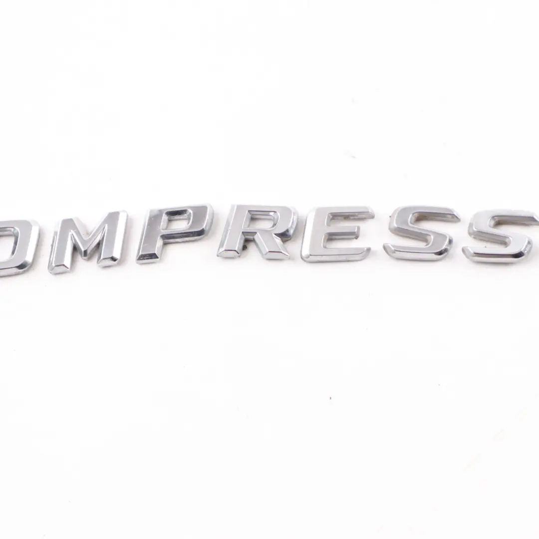 Emblema Parafango Lettering Pannello Ala Anteriore Kompressor per Mercedes SLK R171 con numero di parte A1718170515 Mercedes SLK R171 Emblema Parafango Lettering Pannello Ala Anteriore Kompressor - SKU A1718170515 - Numero di parte A1718170515