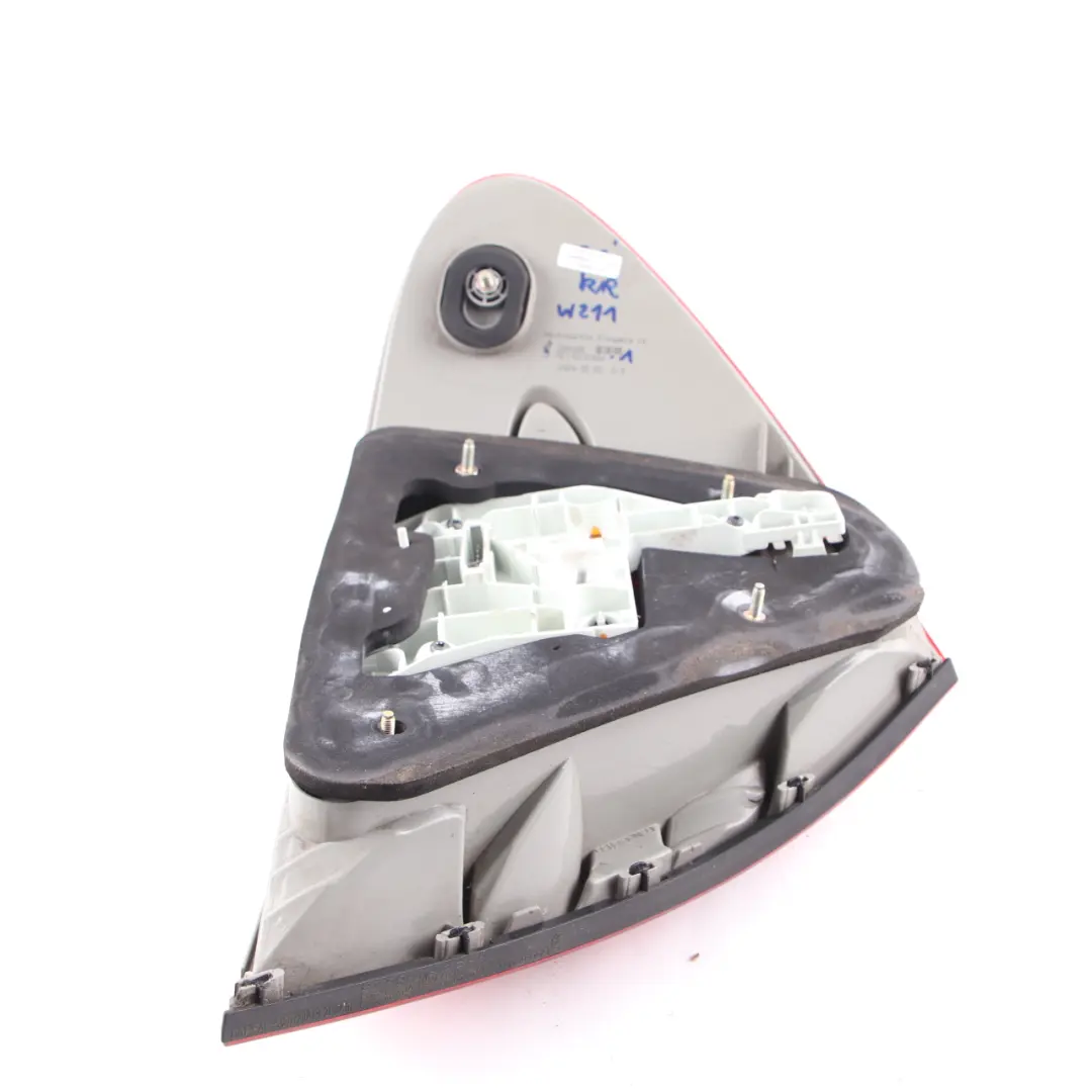 Right O/S Tail Light Lamp Side Panel to Mercedes W211 Rear with Part number A2118200464 Mercedes W211 Rear Right O/S Tail Light Lamp Side Panel - SKU A2118200464-1 - Part number A2118200464