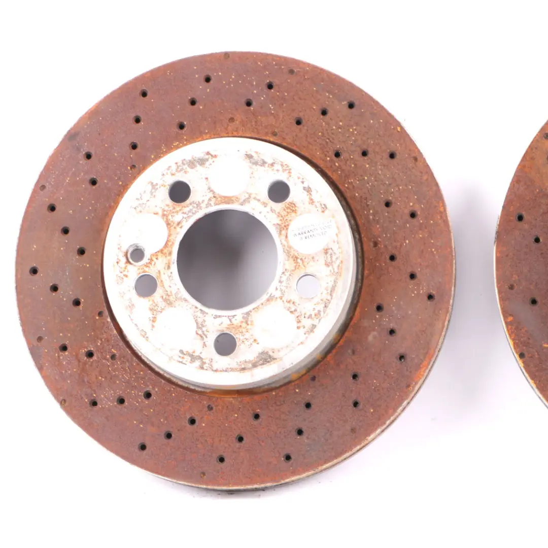 Brake Disc Set AMG Front Left Right Wheel Perforated to Mercedes W176 W246 with Part number A2464212512 Mercedes W176 W246 Brake Disc Set AMG Front Left Right Wheel Perforated - SKU A2464212512 - Part number A2464212512